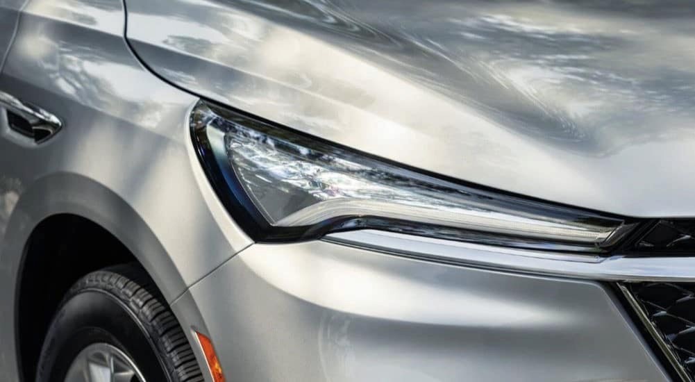 A close up of the front on a silver 2023 Buick Enclave Avenir at a car dealer in Mankato.