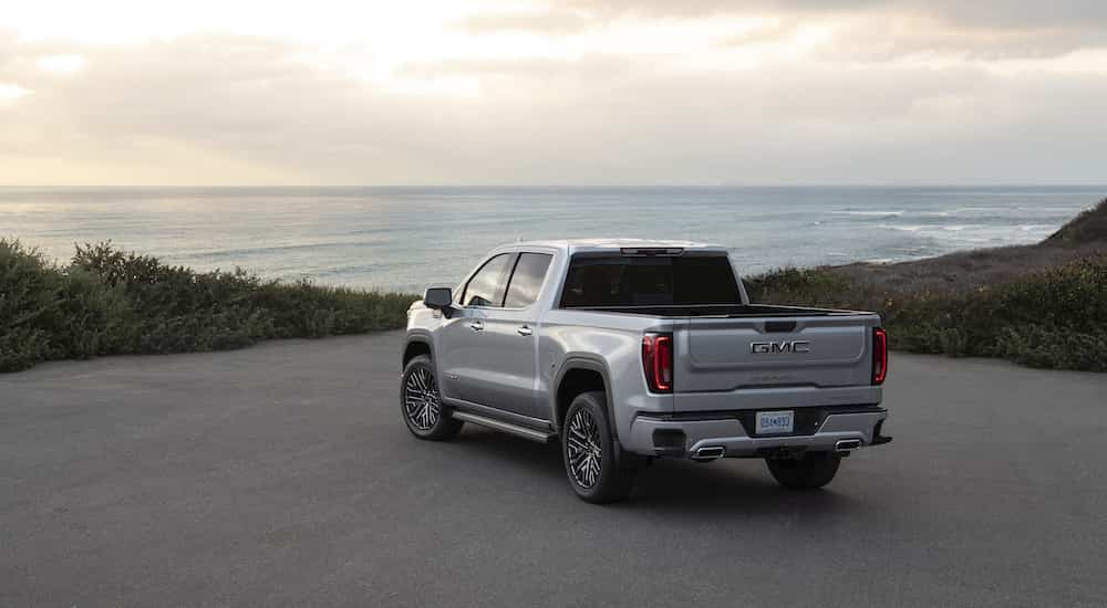 A silver 2025 GMC Sierra 1500 from the rear at an angle.