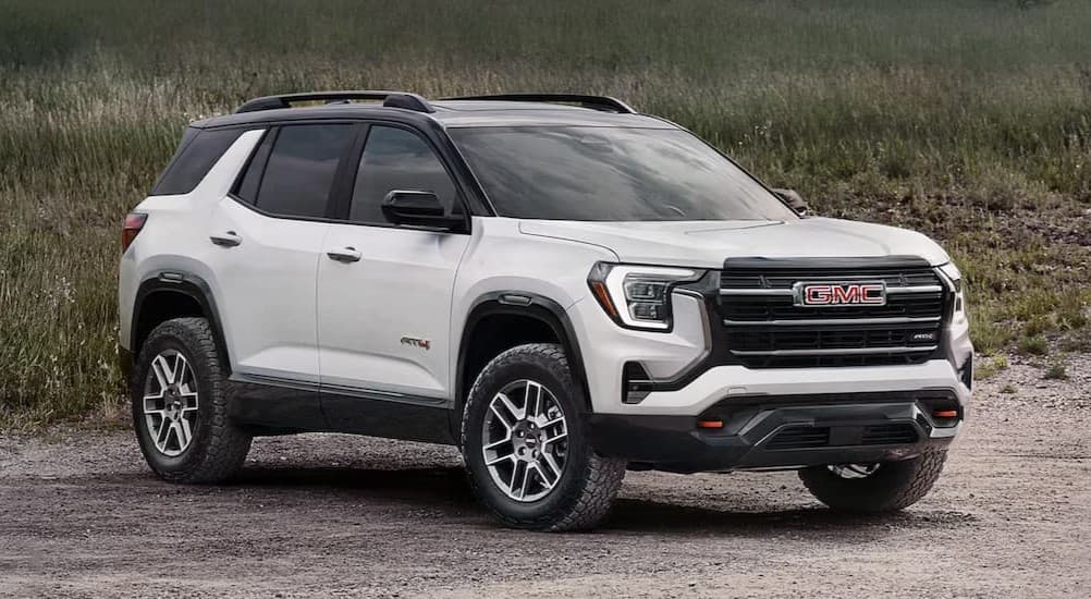 A white 2026 GMC Terrain AT4 parked off-road.