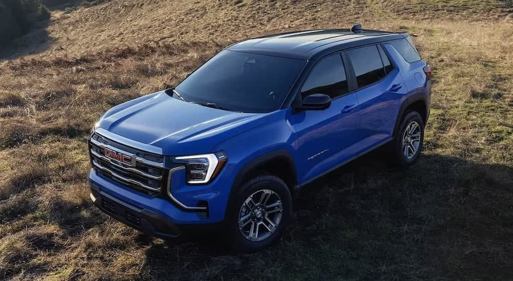 A blue 2026 GMC Terrain Elevation parked offroad.