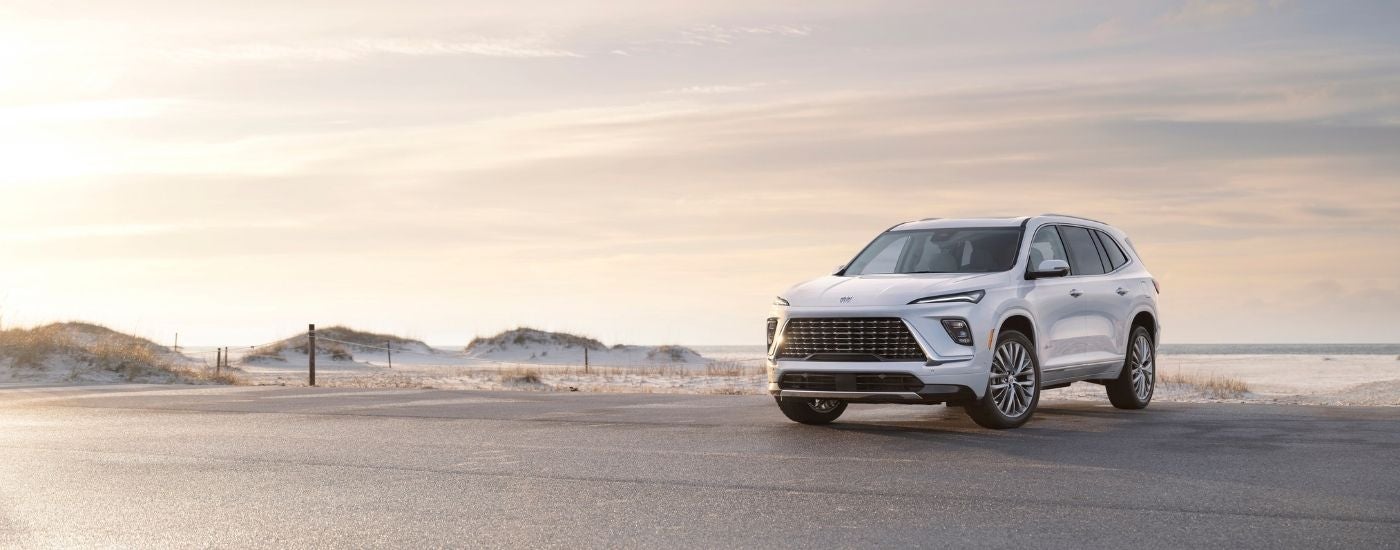 A white 2025 Buick Enclave from the front at an angle.