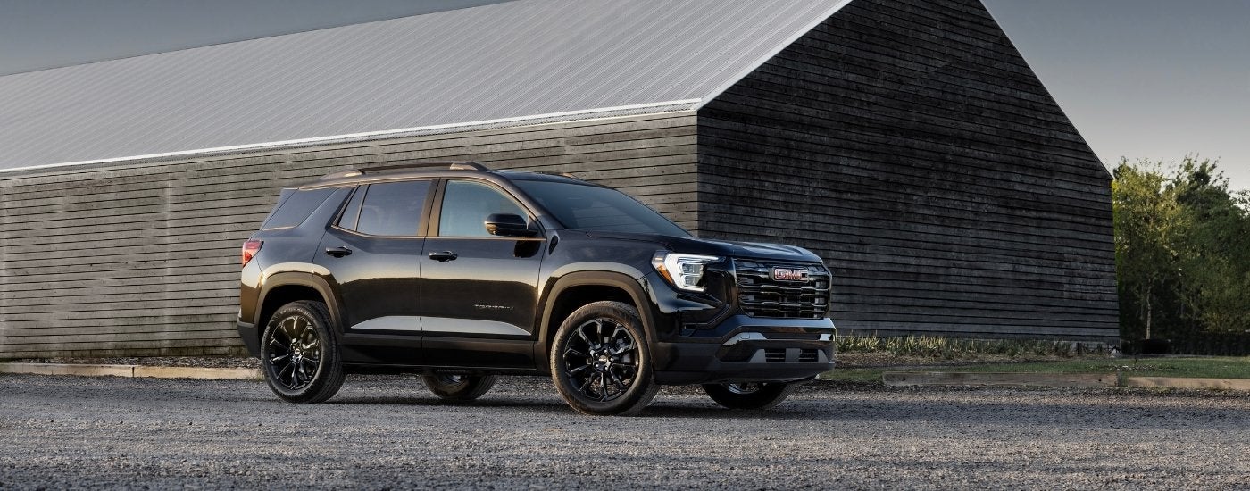 A black 2025 GMC Terrain for sale from the side.