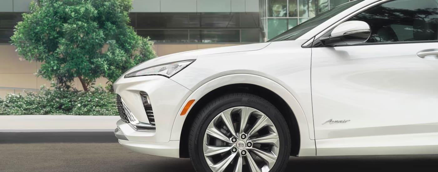 A white 2024 Buick Envista is shown from the side parked after leaving a Buick dealer near Faribault.