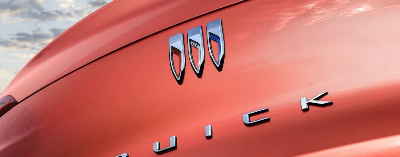 A close up of the rear of an orange 2024 Buick Envista is shown.