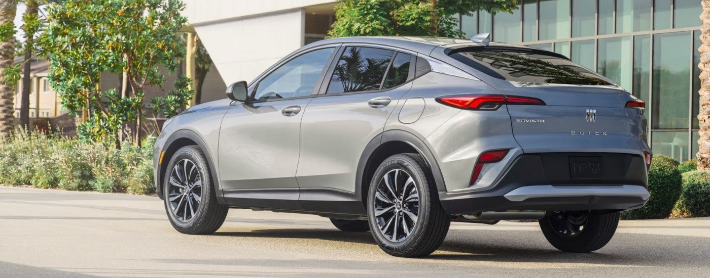 A silver 2024 Buick Envista is parked on the side of a street.