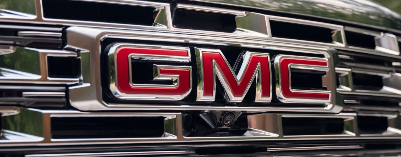 A close up shows the chrome grille on a 2025 GMC Acadia Denali.