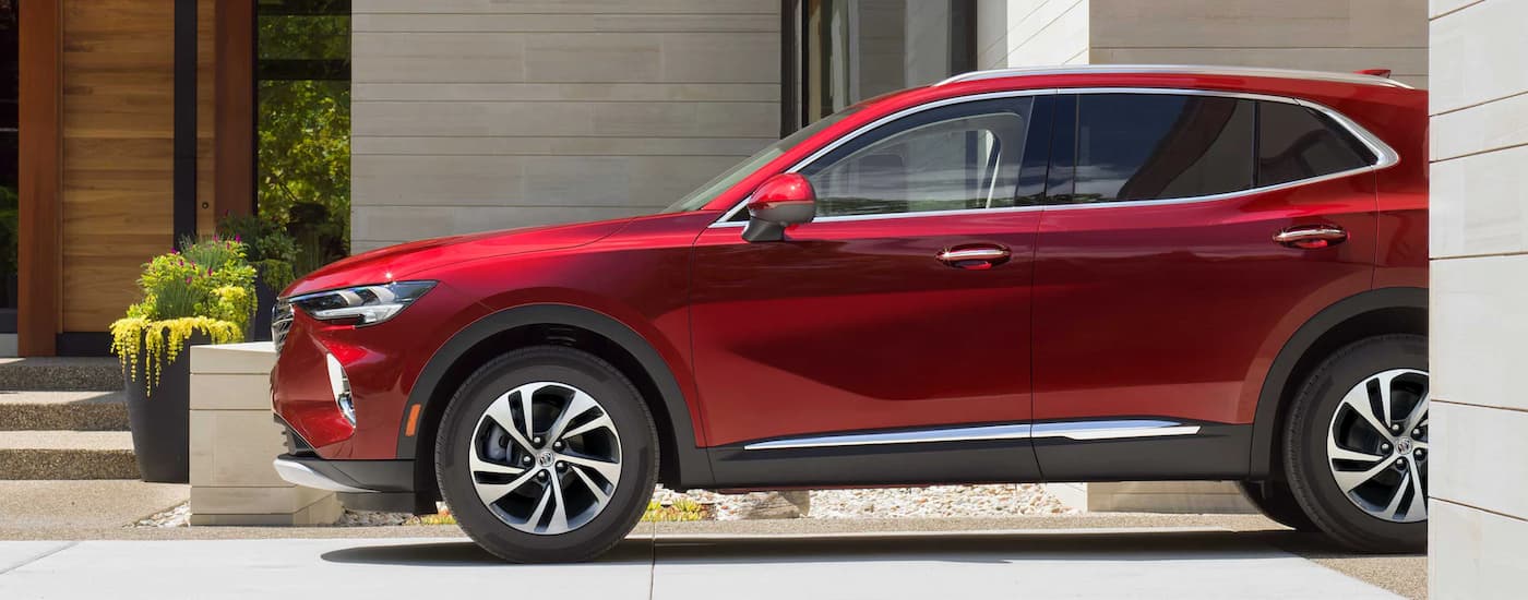 A red 2025 Buick Envision parked in a driveway