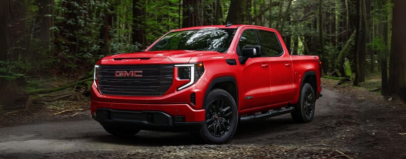 A red 2025 GMC Sierra 1500 Elevation parked off-road